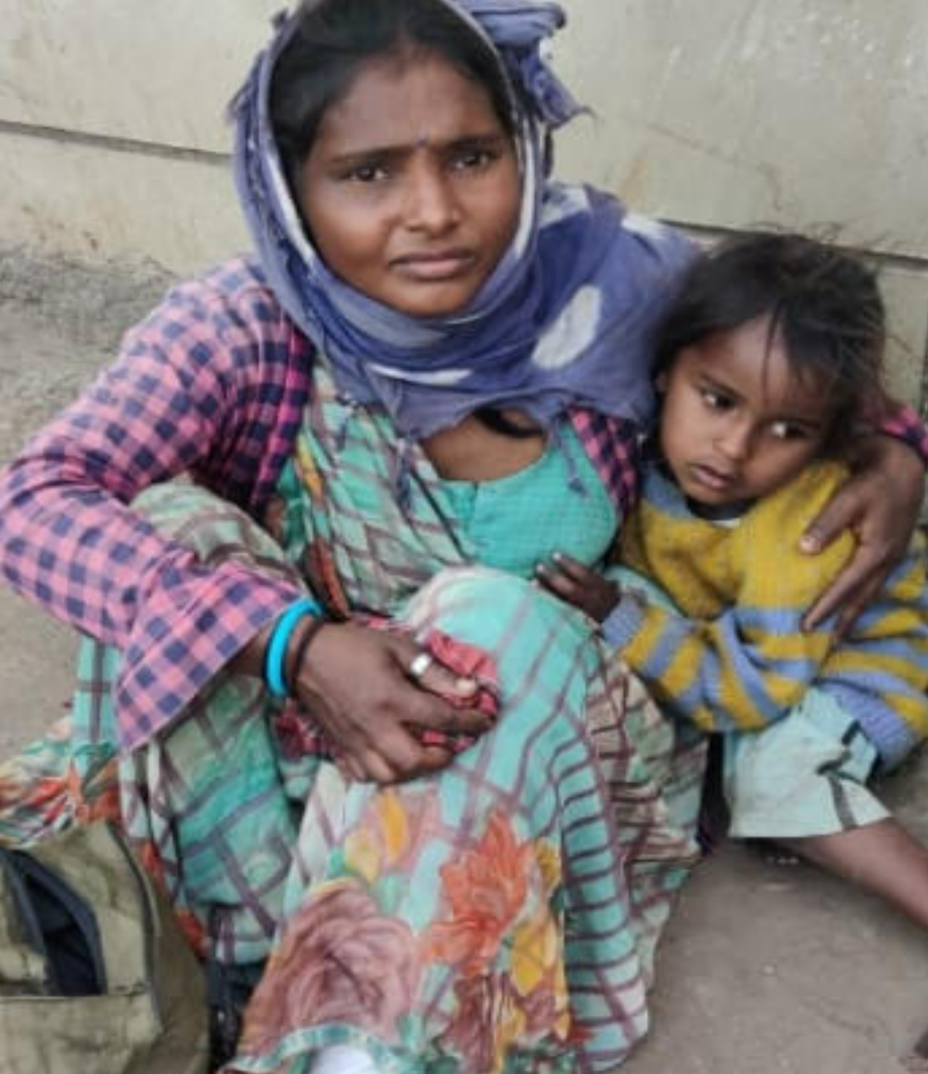 Mother and daughter before receiving help - vulnerable and in need